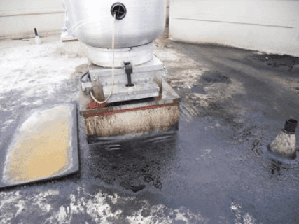 Grease saturation on low-slope roof